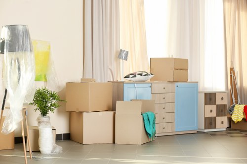 Professional packers handling boxes in Storage Berrylands