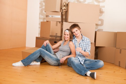Person reviewing a transparent Berrylands storage price estimate with moving boxes