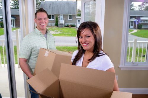 Preparing furniture for storage in Berrylands with wrapping and labeling