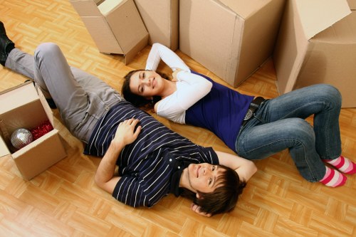 Professional movers handling apartment furniture in Berrylands