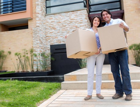 Movers carefully handling furniture during transport in Berrylands